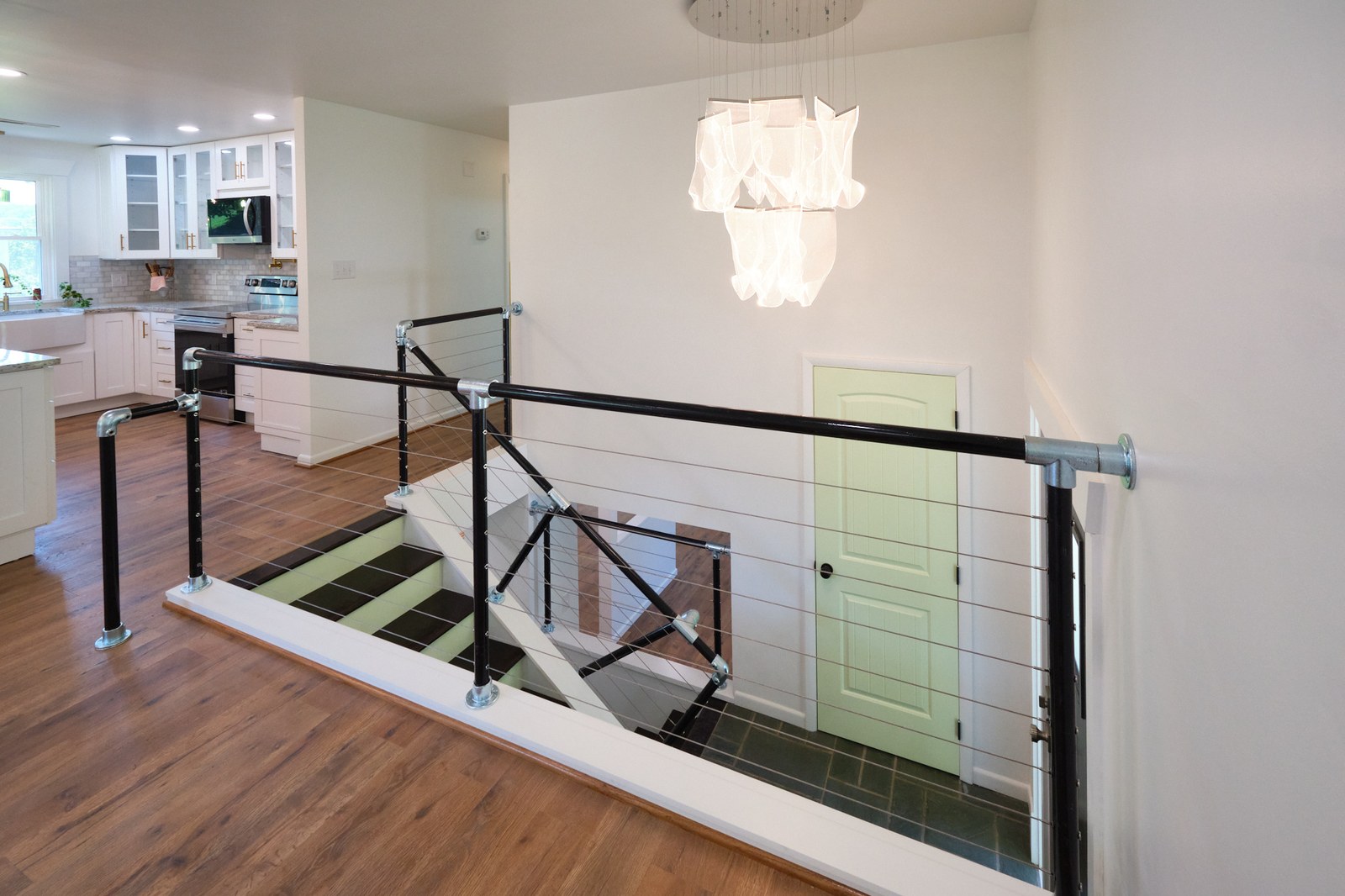 Ribbon light and custom pipe-and-cable railing